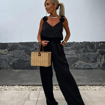 NOËLLE™ | Mouwloze jumpsuit met wijde pijpen